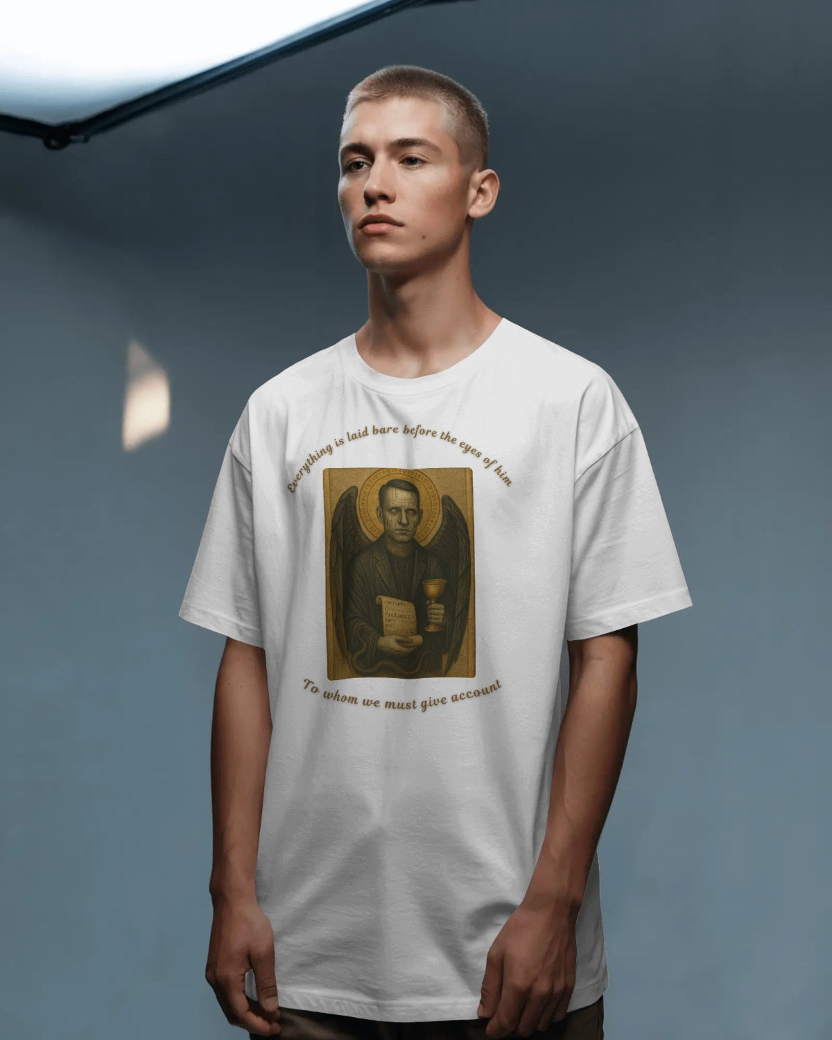 Person wearing a white t-shirt with a printed design on a gray background