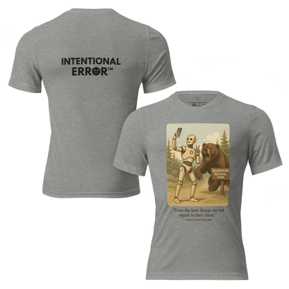 T-shirt featuring a robot taking a selfie in front of a roaring bear at Yellowstone National Park. Satirical AI influencer design.