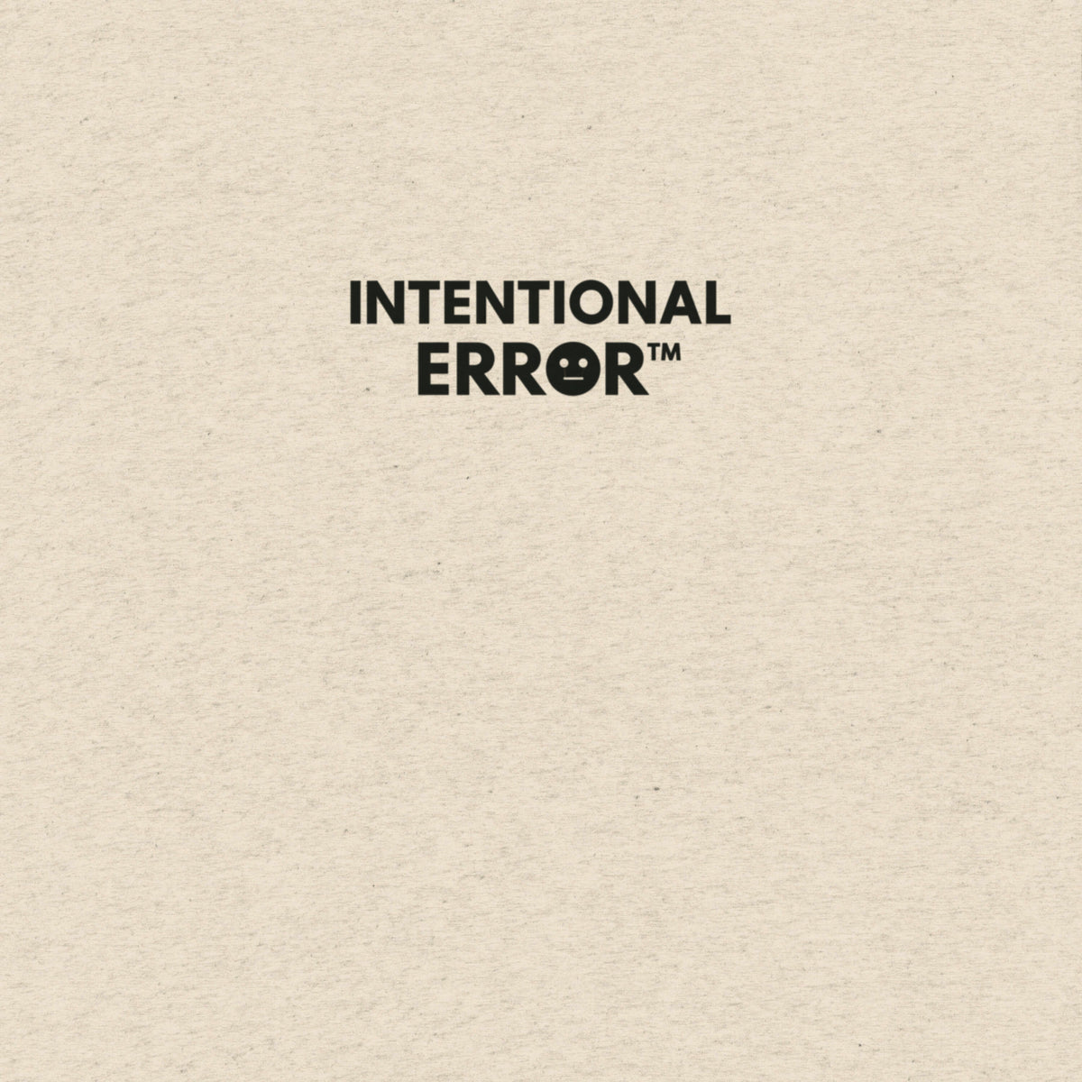 Back of shirt featuring small “Intentional Error” logo centered across the shoulders, minimalist design.