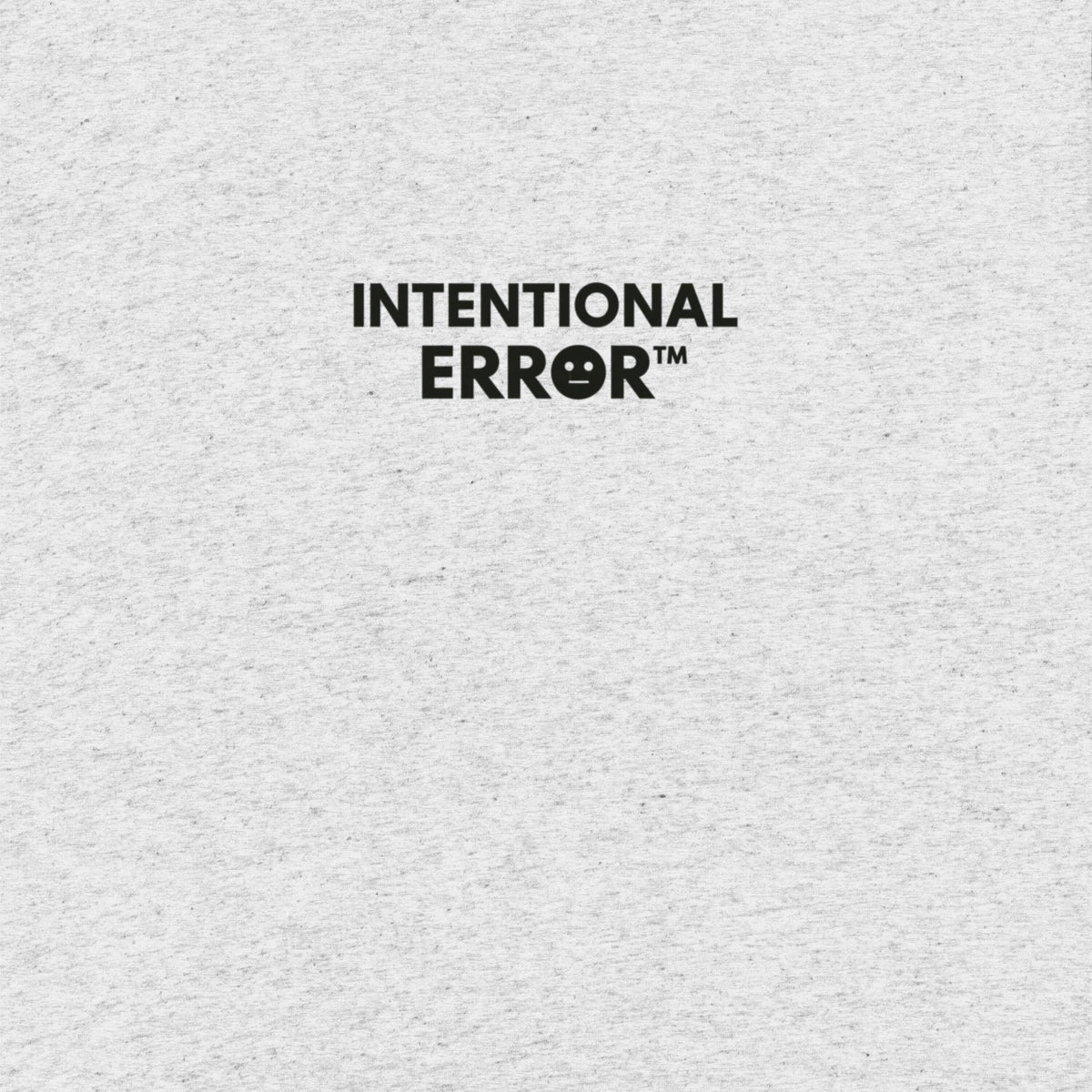 Back of shirt featuring small “Intentional Error” logo centered across the shoulders, minimalist design.